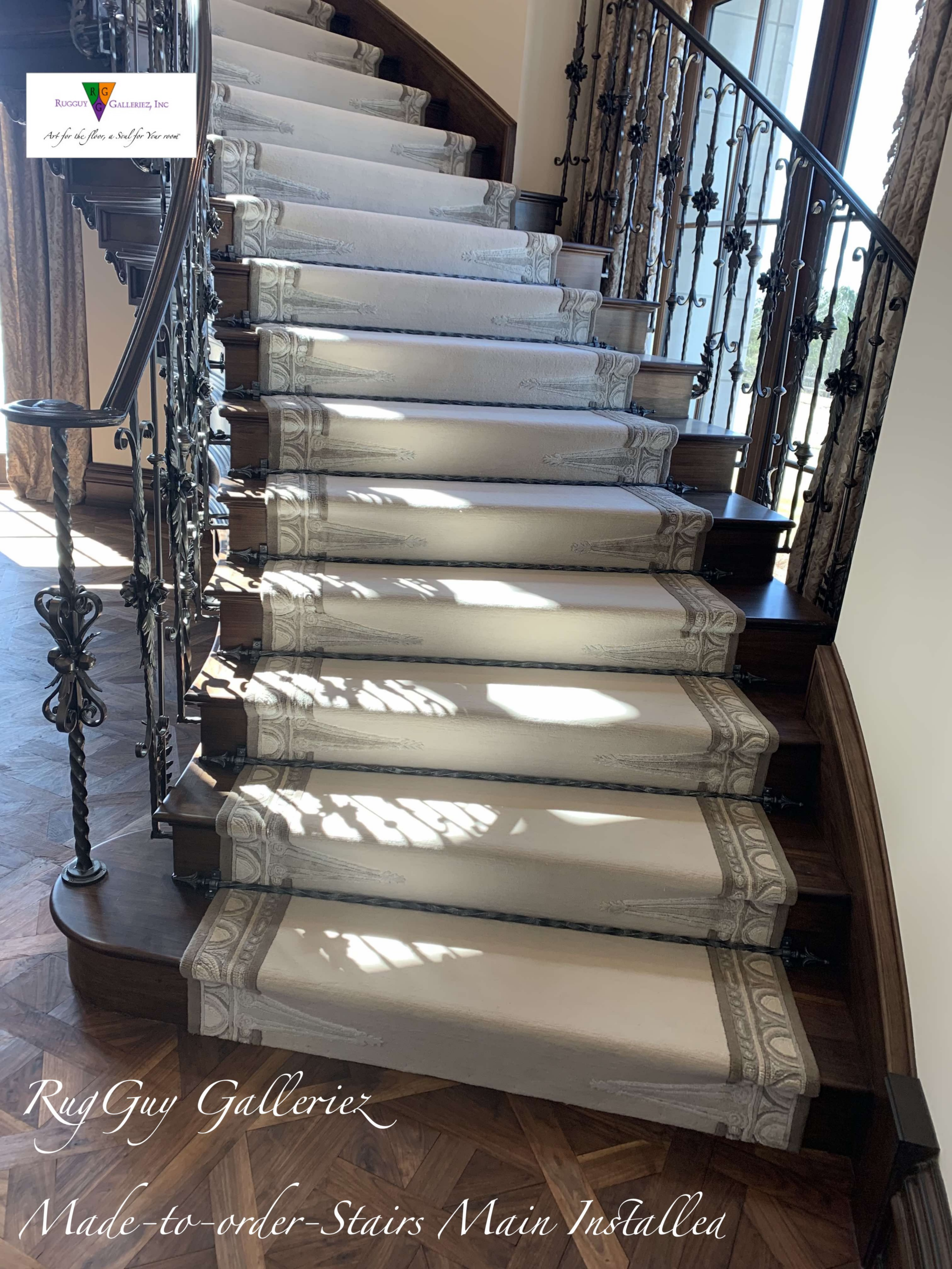 White runner on curved staircase with iron balusters