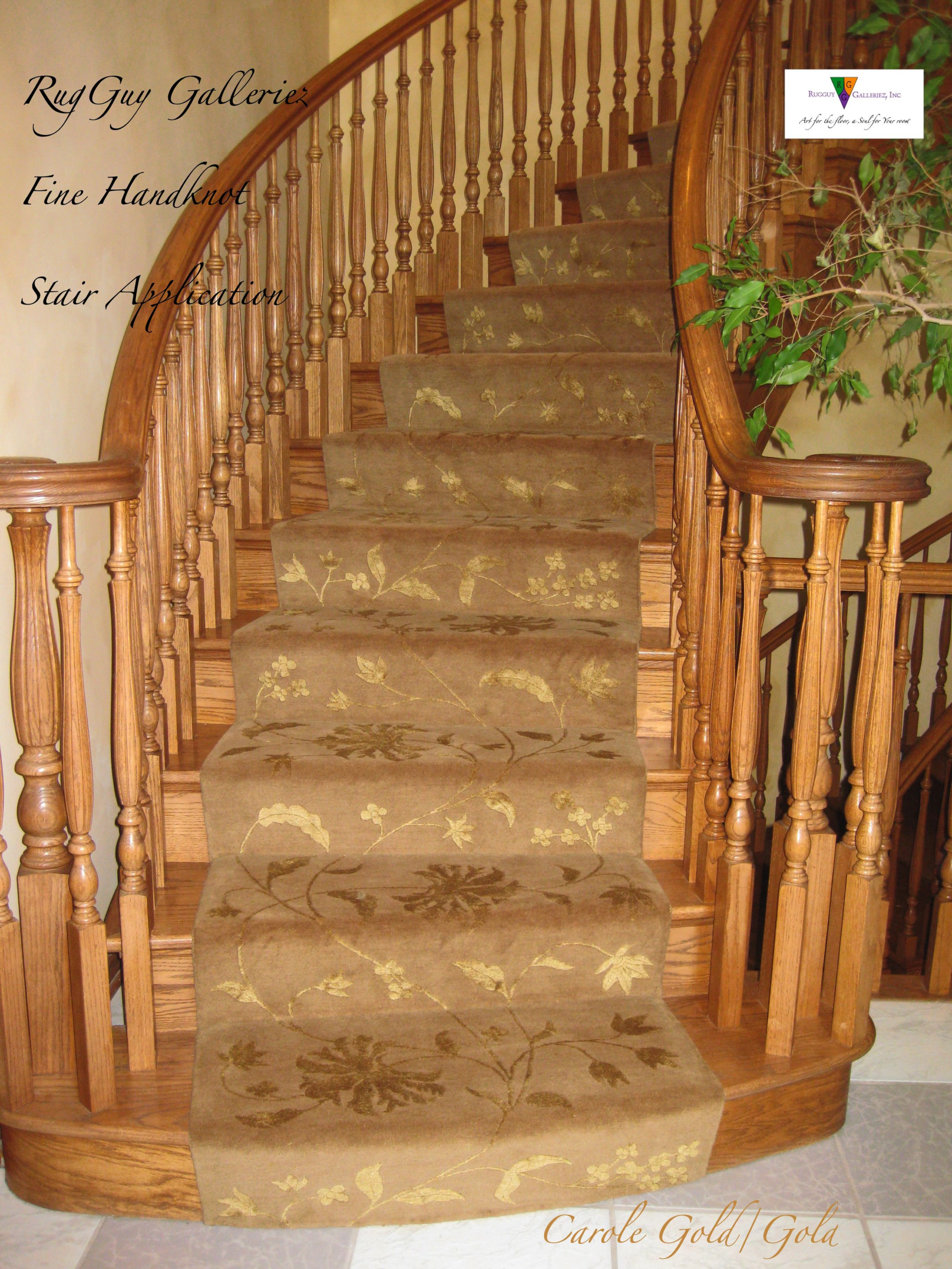 Curved oak staircase with floral carpet runner